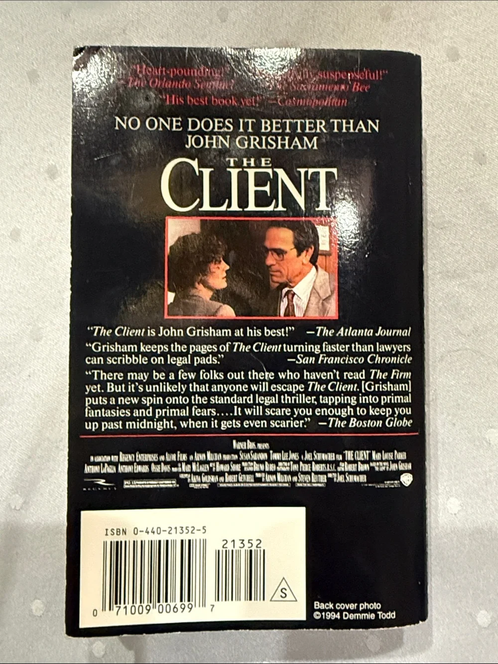 “The Client” a paperback novel by John Grisham